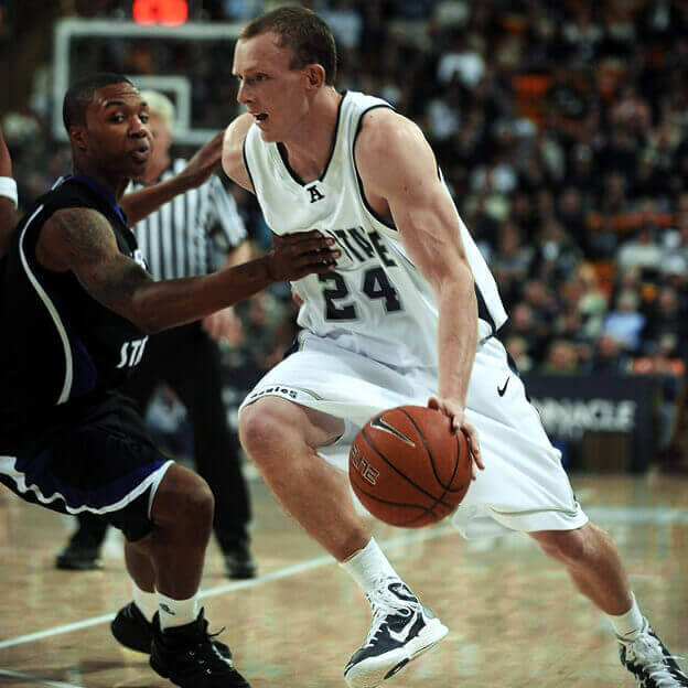 Tyler Newbold dribbling a basketball during a game