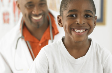 Smiling Young Boy Visiting His Pediatrician