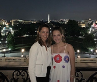 Katama Eastman and daughter stand in front of the Washington Memorial in Washington, D.C.